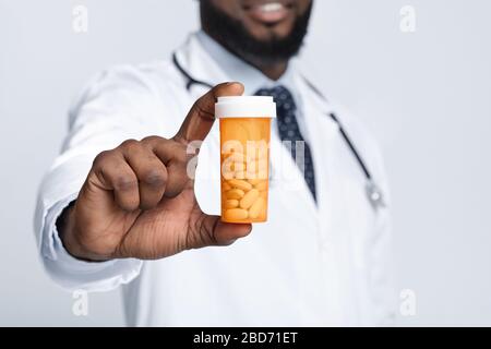 African american male doctor recommending pills, cropped Stock Photo