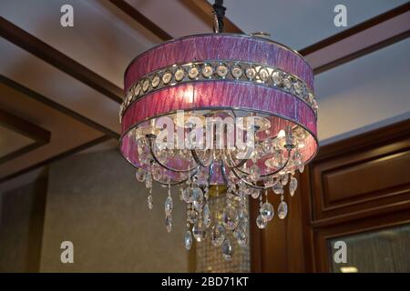 Hanging Lights with Creme Fabric Shade. Modern 3-Light Led pink Chandelier. Pendant Sconce Lighting Lamp . Ceiling Light Oval Pendant Light Fixture. Stock Photo