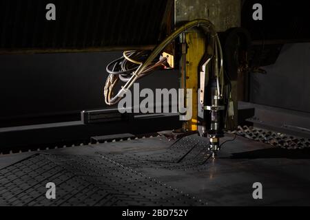 Laser machine, cuts metal, sparks. Industrial cnc plasma machine cutting of metal plate Stock Photo