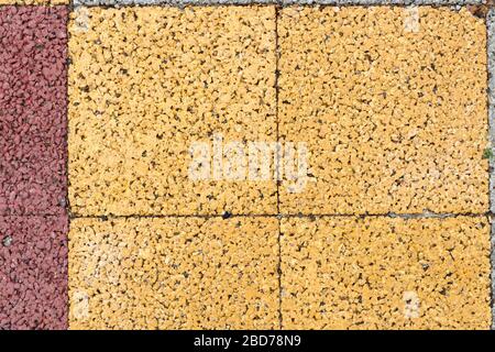 The background is made of paving tiles, the view from above. Stock Photo