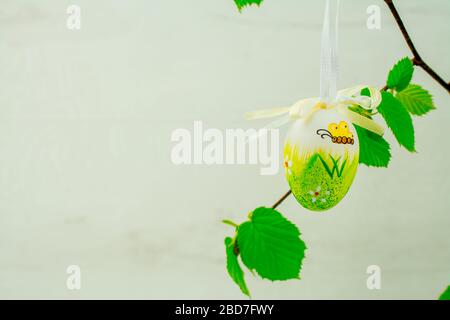 Green tree branch with Easter eggs Stock Photo
