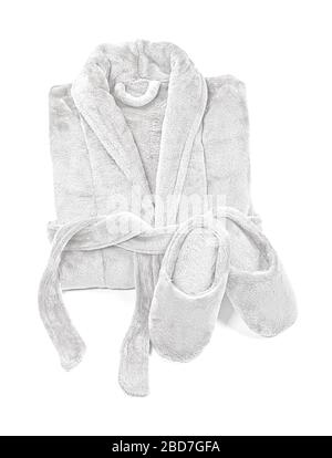 Folded bathrobe, and slippers isolated on white, top view. Stock Photo