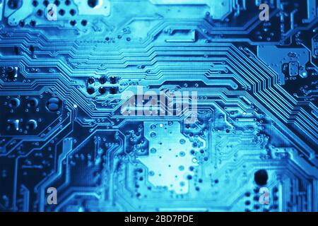 Blue electronic mother board circuit close up macro background. Stock Photo