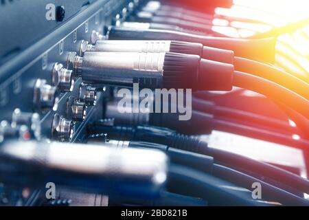 Close up audio jacks cable plugged into mixer console. XLR audio cable Stock Photo