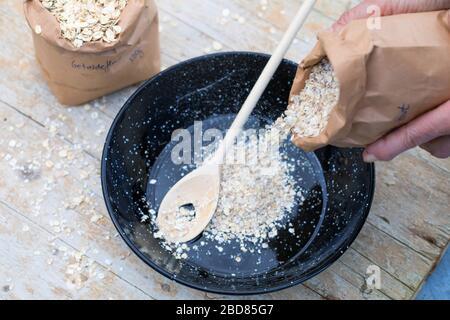 making bird seed with cereal and oil Stock Photo
