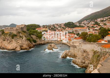 View of Dubrovnik's west harbor, including Fort Lovrijenac, from the Old Town city walls. Stock Photo