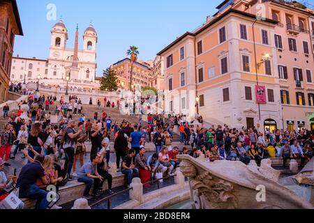 Overtourism, mass tourism, crowds of tourists at Piazza di Spagna, Spanish Steps, Trinita dei Monti Church, Rome, Italy. Stock Photo