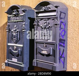 Two blue postboxes on the night street Stock Photo