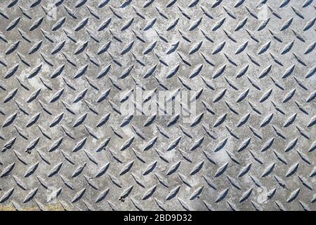Closeup of aged metal diamond plate. Stock Photo