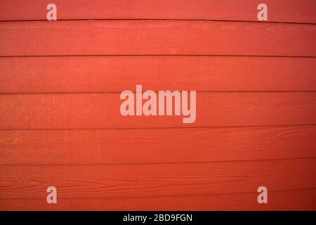Closeup of painted red boards on a sunny day. Stock Photo