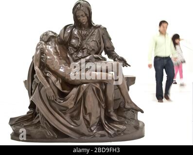 Visitors descend past a bronze copy of Michelangelo's Pieta in Mexico City's Soumaya Museum, owned by billionaire Carlos Slim Stock Photo