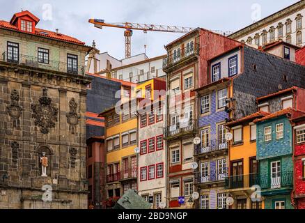 Porto, Portugal - May 29, 2018: Facades of traditional houses decorated with ornate Portuguese azulejo tiles on the famous Ribeira square Stock Photo