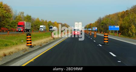 Ontario, Canada - October 28, 2019 - The view of the slow traffic around the construction area on Route 401 highway Stock Photo