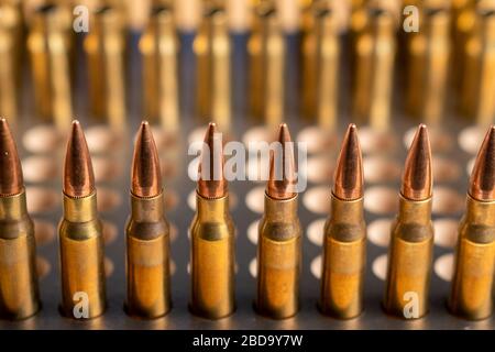 Production of cartridges for a rifle, reload. Empty shells and ammunition Stock Photo