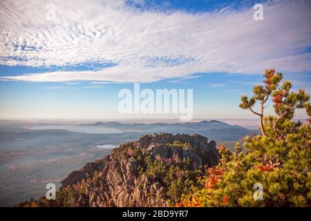 Epic view from the highest point of Sinyuha Mountain in autumn season in Burabay, Kazakhstan. Approach of the cyclone, the movement of low clouds over Stock Photo