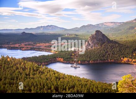 Majestic nature of Kazakhstan concept: epic view of Burabay lake with Okzhetpes and Zhumbaktas rocks at sunset in autumn season Stock Photo