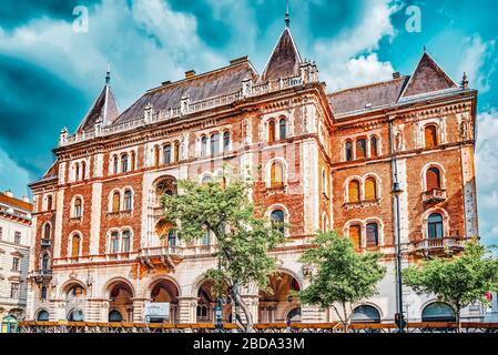 BUDAPEST, HANGARY-MAY 02, 2016 :Dreschler Palace-gorgeous building in front of the Opera in Budapest. Street view with people. Stock Photo