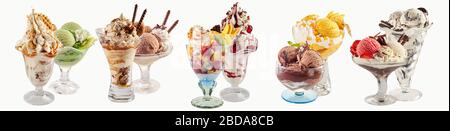 An assortment of various ice-cream sundaes on a white background with copy space. Stock Photo