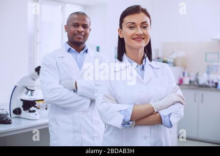 Joyful professional researches having successful results in reseach Stock Photo