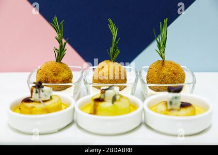 Potato croquette with rosemary served with caramelized pear with Dor Blue cheese Stock Photo