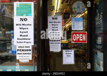 New York, NY, 4th April 2020. Coronavirus COVID-19 related signs taped to the window of store SEE MORE INFO FOR FULL CAPTION Stock Photo