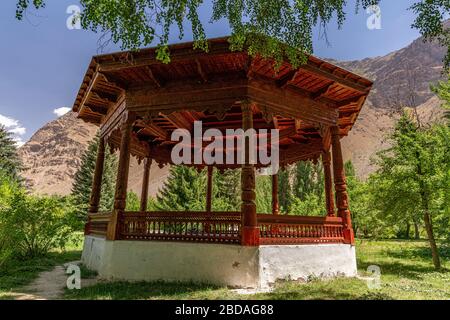 Old Wooden Pavilion in Khorog Botanical Garden, Khorog, the capital of Shughnon District in Gorno-Badakshan in the Pamir Mountains of Tajikistan. Stock Photo