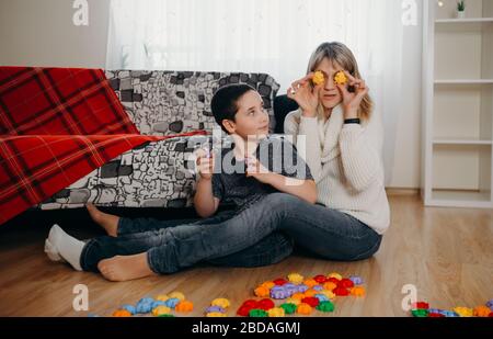 Mother and little boy have fun engaged. Concept of distance education Stock Photo