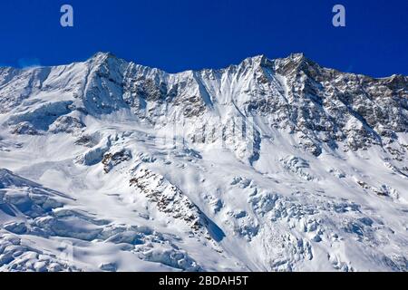 Snow-covered peaks Täschhorn, Dom, f.l.t.r.,  Mischabel mountain range, Saas-Fee, Valais, Switzerland Stock Photo