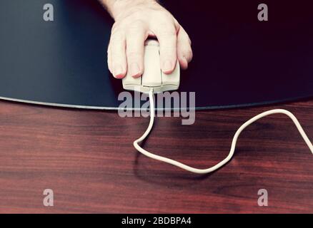 male hand using computer mouse Stock Photo