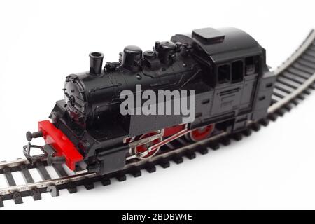 old toy steam engine on a white background, soft focus Stock Photo