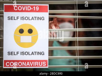 A woman in self isolation at home in the UK during the coronavirus Covid 19 pandemic. Stock Photo