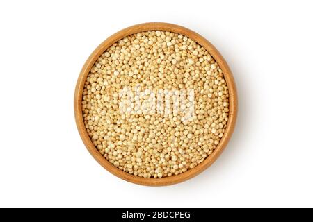 Quinoa in wooden bowl on white background Stock Photo