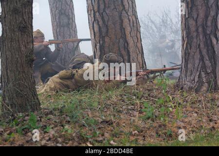 Vorzel, Ukraine - November 03, 2019: People in uniform of fighters of the Red Army of World War II conduct a battle at historical reconstruction Stock Photo