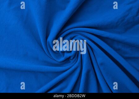 Classic blue delicate fabric draped and spun. Closeup. Stock Photo