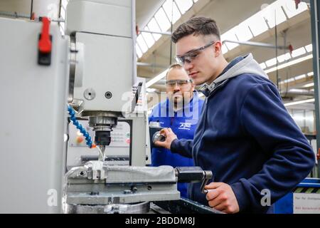 12.02.2020, Remscheid, North Rhine-Westphalia, Germany - Trainee in metal professions, here with trainer at a machine tool, vocational training centre Stock Photo
