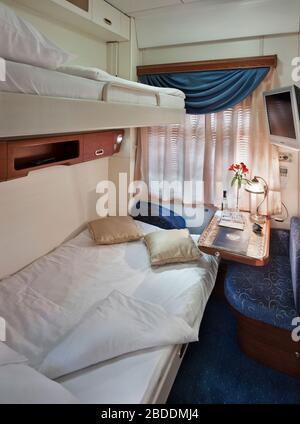 compartment in a luxury Trans-Siberian Express; Train compartment; Long distance train; sleeping car Stock Photo