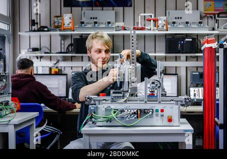 12.02.2020, Remscheid, North Rhine-Westphalia, Germany - Apprentice in metal and electrical professions, an industrial mechanic assembles an electro-p Stock Photo
