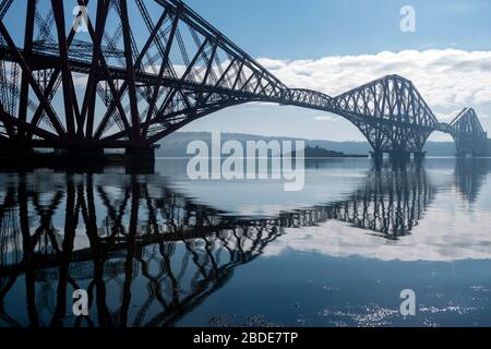 Forth Rail Bridge, with Inchgarvie island visible under span, viewed from the harbour on South Bay, North Queensferry in Fife, Scotland, UK