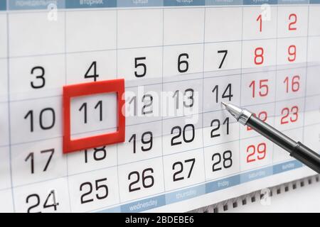 Pen indicates future friday on wall calendar Stock Photo