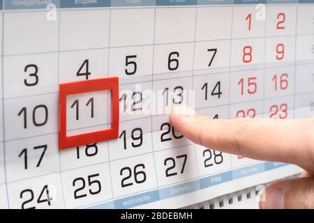 The finger points to the future Thursday on the calendar Stock Photo