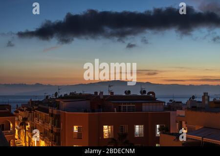 Twilight sky over La Gomera seen from Playa San Juan, Tenerife, Canary Islands, Spain Stock Photo