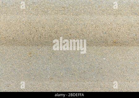 Pebbles in the concrete. Beautiful stone floor path. Background and texture. Stock Photo