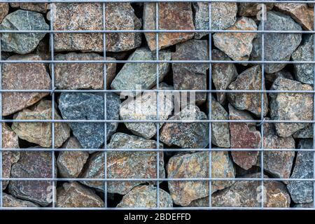 texture background - rock behind the grid, wall. Stock Photo