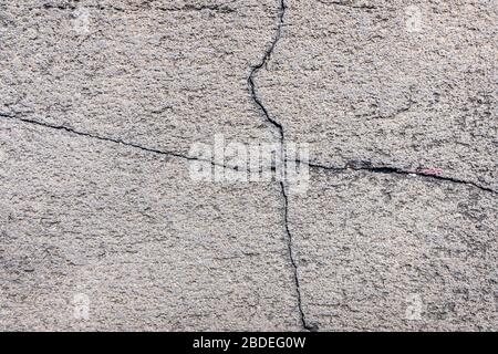 concrete wall background. Phillips cracks divide the background on tyre part. suitable for sections and text. Stock Photo