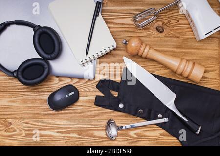 Various kitchenware utensils on the wooden background for cooking. Stock Photo