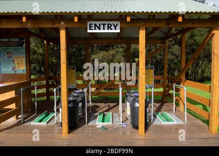 Entry with cleaning equipment to protect against organic contamination in park, Hunua Falls, Wairoa River, Hunua, Auckland Region, North Island Stock Photo