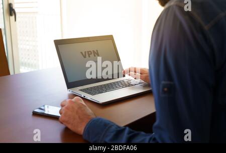 Man working from home and worried about covid-19 coronavirus Stock Photo