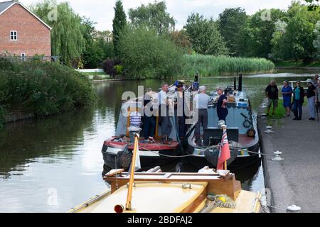 Moored up narrow boats on the Trent and Mersey Canal, Northwich, Cheshire, England; Stock Photo