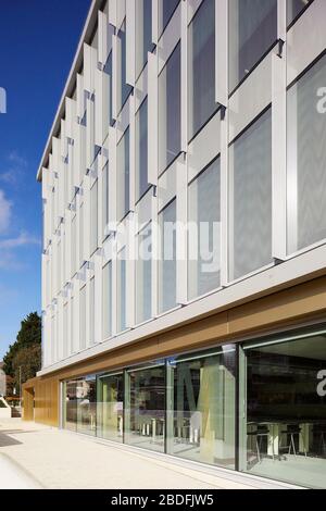 View along exterior facade with view through window on street level. STEM Building - University of Bedforshire, Luton, United Kingdom. Architect: MCW, Stock Photo