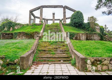 destroyed building in the park of Poti, steps with grass, Georgia Stock Photo